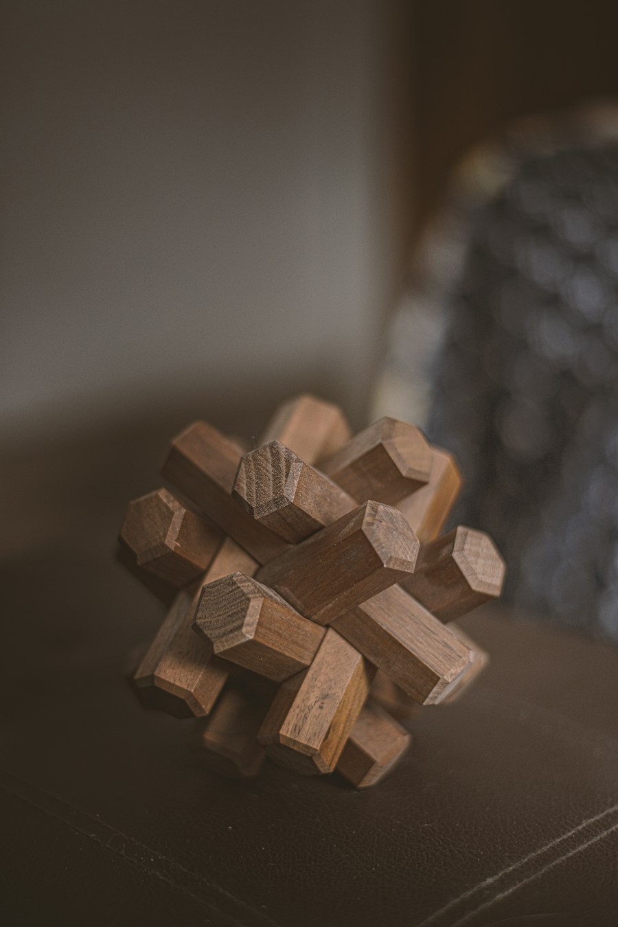 Interlocking wooden puzzle made from notched wooden pieces